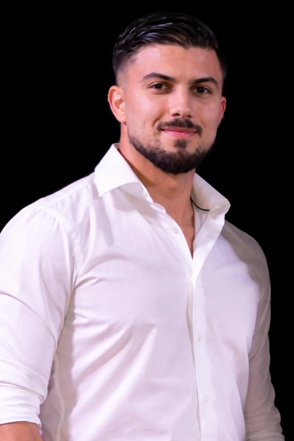 Portrait of DJ Ciro B in a white shirt